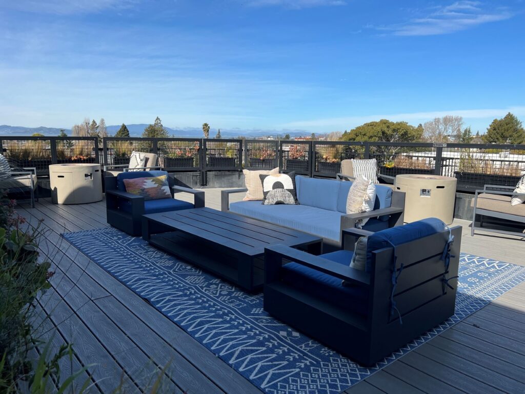 Telegraph Gardens rooftop deck with sofas, grills, games, and lounge spaces