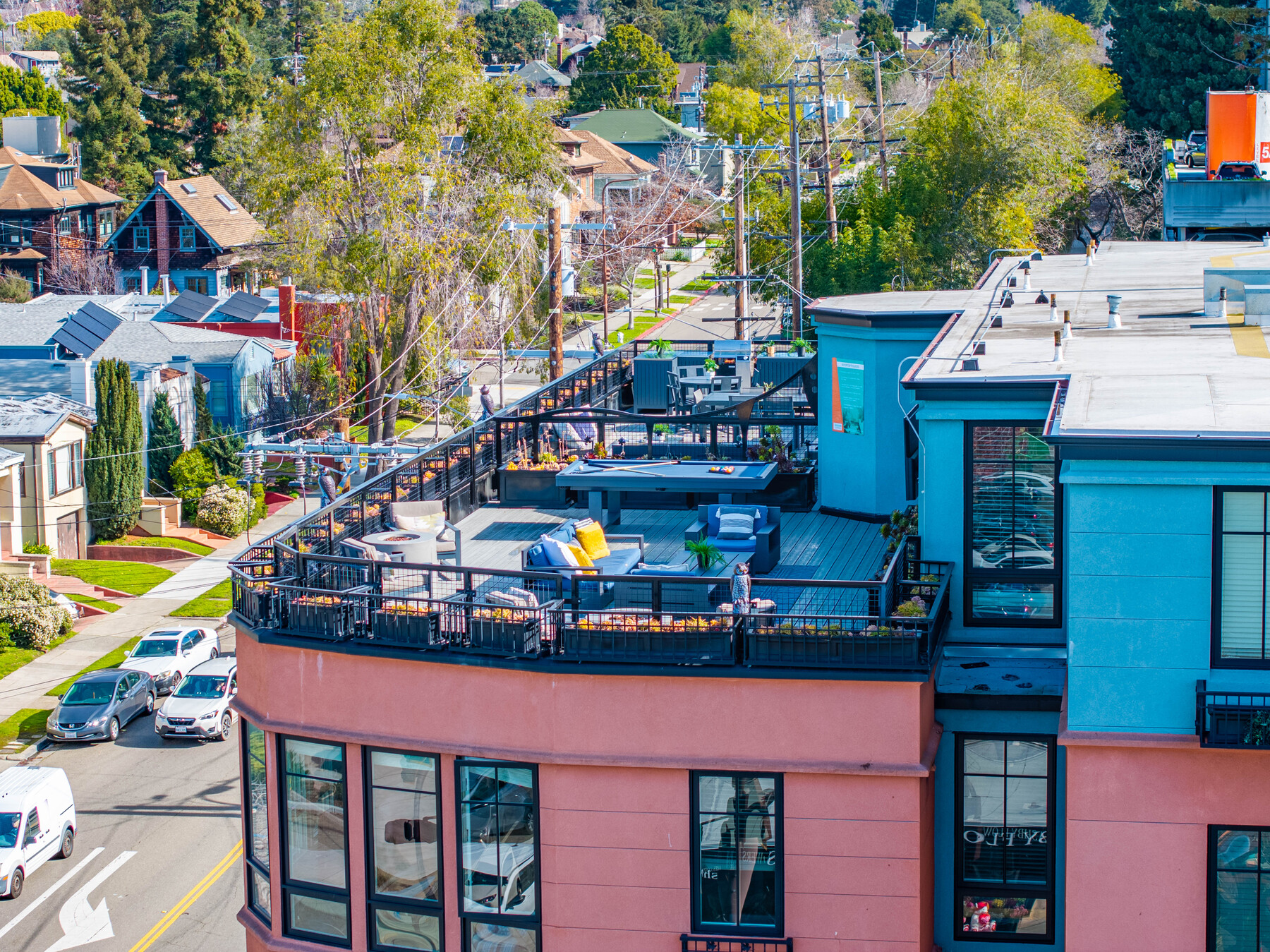 Telegraph Gardens Apartments exterior with rooftop lounge in a walkable Berkeley, CA neighborhood.